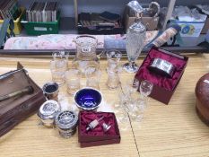 A collection of silverplate ware including claret jug and wine coaster and a 12 piece glass jug and