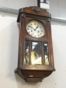 A 1930's oak wall clock