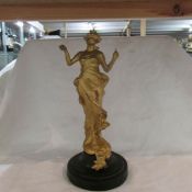 An art nouveau spelter figure.