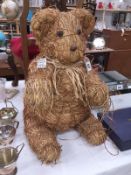 A John Lewis? shop display? straw bear.