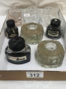 A mixed lot of glass inkwells and ink bottles.