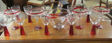 A good quality T.G.I Fridays glass bowl with 4 matching sundae dishes and 10 red based wine glasses.