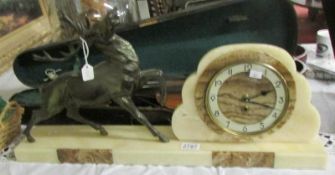 A French art deco marble clock surmounted stag (battery movement).