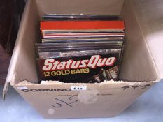 A box of over 30 LP records including Cliff Richard & The Shadows, Abba, Status Quo, Shirley Bassey,