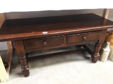 A dark oak 2 drawer coffee table