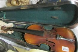 A Stradivarius copy violin in case (no bow).