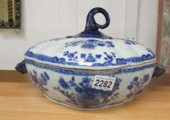 An 18th century Chinese blue and white tureen with cover (a/f, cracked).