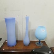 2 blue glass vases and a large blue glass goblet.