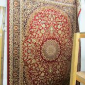 A red ground Keshan carpet, 230 x 160 cm.