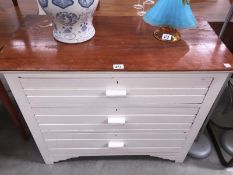 A shabby chic painted satin walnut chest of drawers.