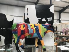 A boxed Cow Parade art cow