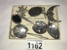 6 silver brooches a silver caddy spoon & 2 other silver spoons