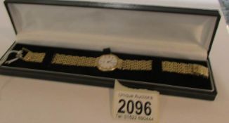 A Baume & Mercier 18ct gold ladies bracelet watch - rear of watch inscribed '14-2-89' and marked