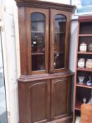 A mahogany 4 door glazed top corner cupboard