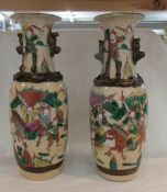 A pair of Chinese vase with dog handles (1 vase a//f, cracked).