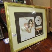 A framed and glazed Celine Dion display.