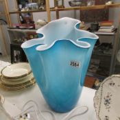 A large studio glass vase in turquoise.