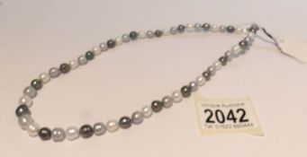 An Honora pearl necklace in shades of grey, black and white.