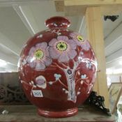 A large hand painted vase.