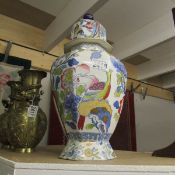 An early 20th century Mason's Ironstone lidded jar decorated with exotic birds, (lid a/f).