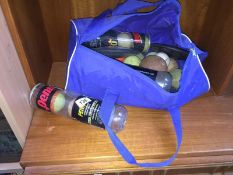 A bag containing discus/shot put & tennis balls