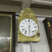 A French wall clock with pressed glass face.