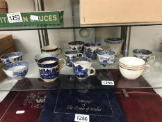 A collection of 18th/19th century blue & white cups & coffee cans from various makers including