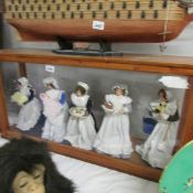 A dolls depicting servants in a glass cabinet, (collection only).