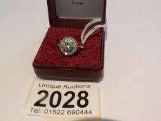 An 18ct white gold ring set with diamonds, hall marked 18ct, approximately 5 grams, size M half,