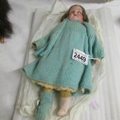 An early Victorian doll with kid leather legs (right hand damaged).