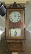 A Victorian inlaid wall clock.