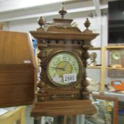 An oak mantel clock.