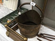 A brass coal scuttle