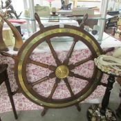 A large old ship's wheel.
