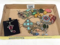 A mixed lot of vintage pendants and necklaces etc.