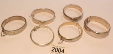 6 hall marked silver bangles.