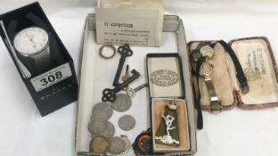 A mixed lot including watches, coins, badges etc.