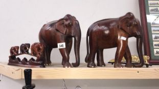 3 wooden elephants and one other.