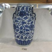 A Chinese blue and white vase with dragon handles a/f.