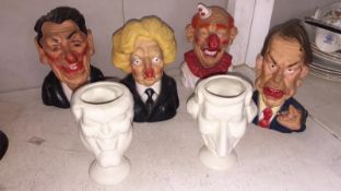 2 unmarked Carlton Ware spitting image caricature eggcups and 4 squeaky dog toys