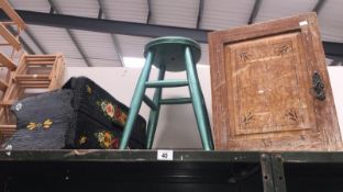 2 wooden stools and a small cupboard.