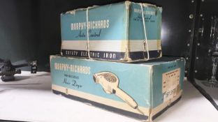 A vintage boxed Morphy Richards iron and hair dryer.