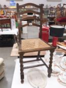 An oak hall chair with wicker seat