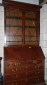 A Victorian mahogany bureau bookcase with fitted interior.