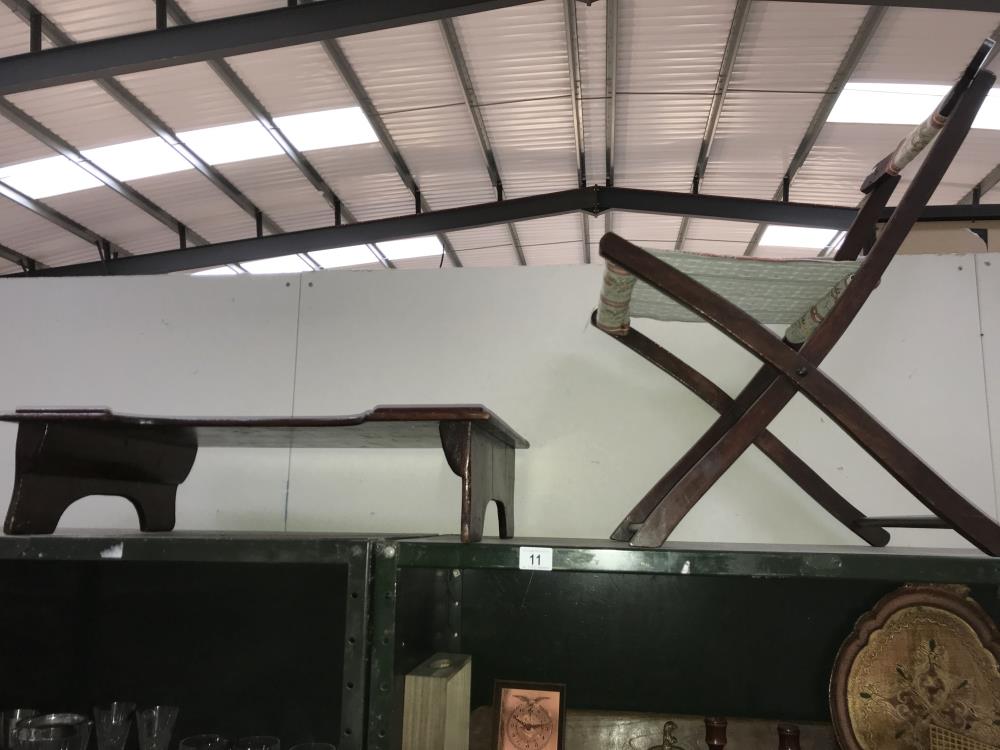 An Edwardian dark pine stained bed table and a folding chair