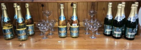 A quantity of Babycham glasses and bottles of Babycham sparkling perry