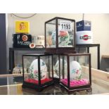 4 handpainted eggs in display cabinet