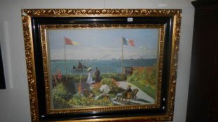 An ornate framed print of Claude Monet's 'Garden at Sainte Adresse'.