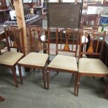 A set of 4 mahogany inlaid chairs.