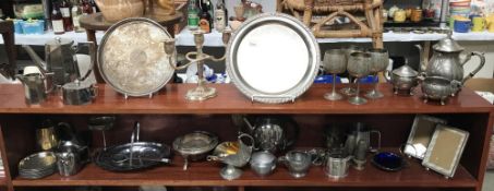 A collection of silver plate and pewter items including teapots, goblets etc.